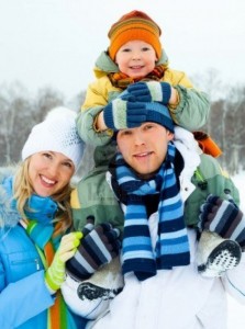6027456-happy-young-family-spending-time-outdoor-in-winter-park