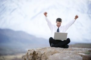 iStock_12573288LG-happy-man-laptop-rock
