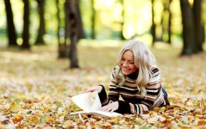 Blonde-Girl-Reading-Book-On-Yellow-Leaves-HD-Wallpaper