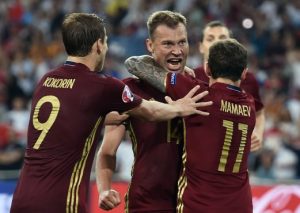 epa05358380 (L-R) Aleksandr Kokorin, Vasili Berezutski and Pavel Mamaev of Russia celebrate after Denis Glushakov (not pictured) scored the equalizing goal during the UEFA EURO 2016 group B preliminary round match between England and Russia at Stade Velodrome in Marseille, France, 11 June 2016. (RESTRICTIONS APPLY: For editorial news reporting purposes only. Not used for commercial or marketing purposes without prior written approval of UEFA. Images must appear as still images and must not emulate match action video footage. Photographs published in online publications (whether via the Internet or otherwise) shall have an interval of at least 20 seconds between the posting.) EPA/PETER POWELL EDITORIAL USE ONLY