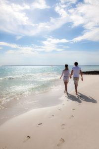 weddings-by-funjet-concierge-couple-walking-beach-destination-wedding