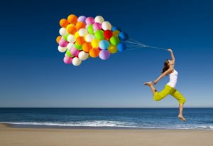 happy-woman-jumping-on-the-beach